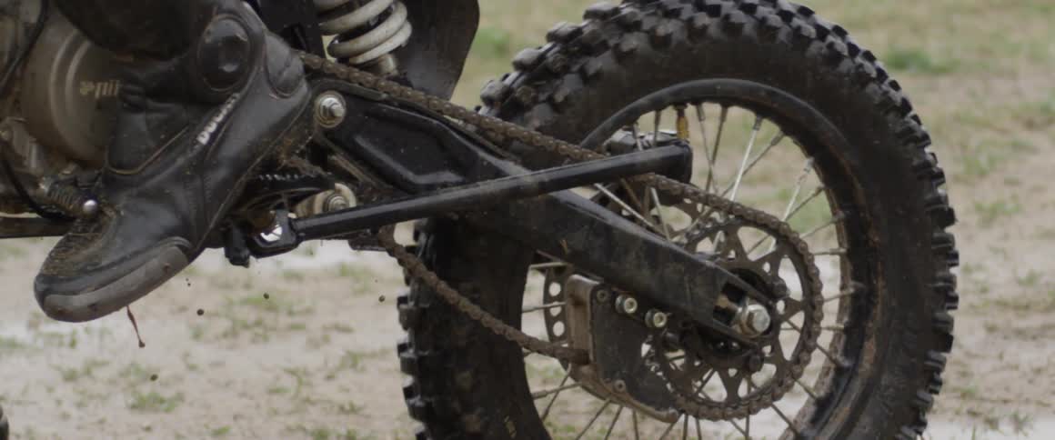 Mud spraying off of the tire of a dirt bike