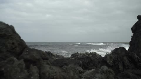 Waves crash on a rocky beach