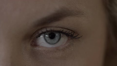 A woman opens her eye