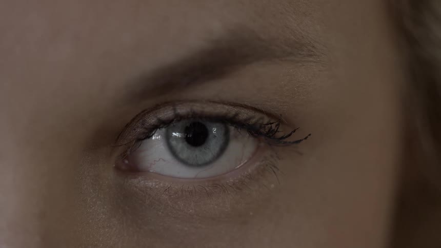 A woman opens her eye