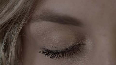 A woman opens her eye