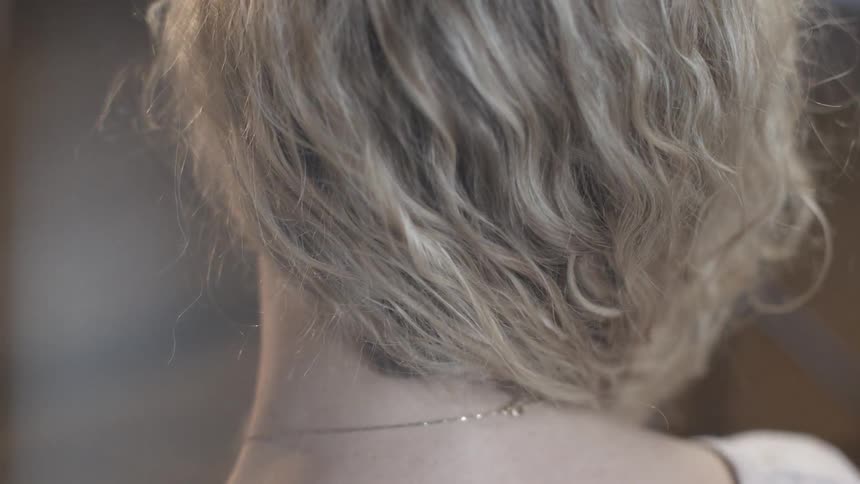 A woman plays with her hair