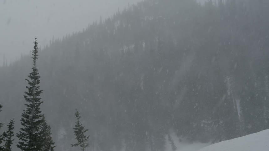 Fog rolls along the mountain