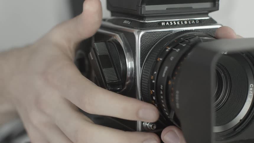 A man prepares to take a picture with a camera