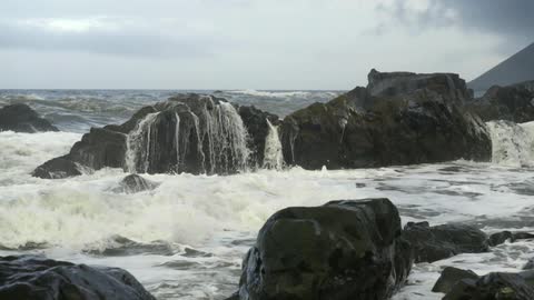 Waves crash on a rocky beach