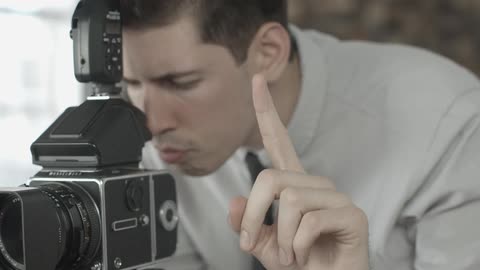 A man is preparing to film a show