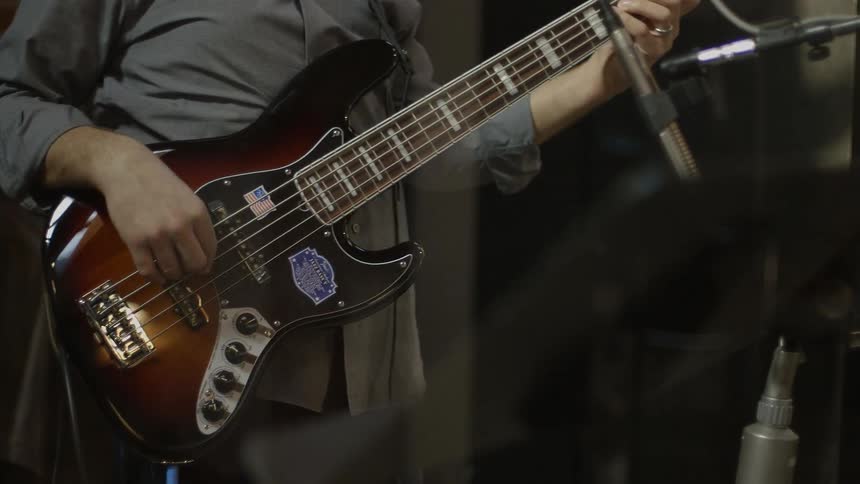 A man plays an electric guitar