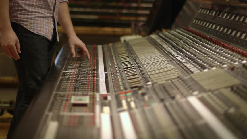 A man is working on music