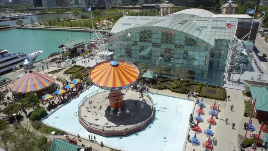 A carnival ride alongside the harbor