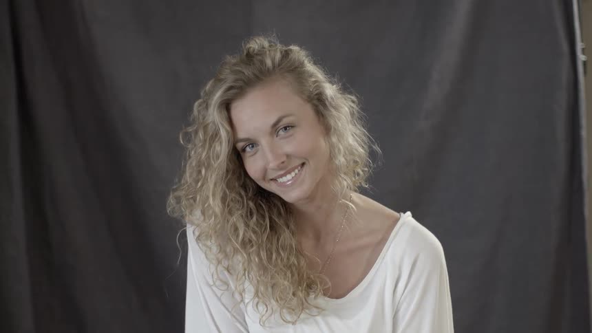 A woman smiles
