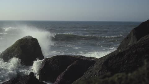 Waves crash on a rocky shore