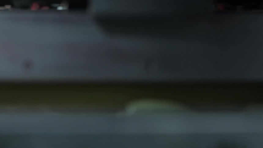 A machine is moving back and forth