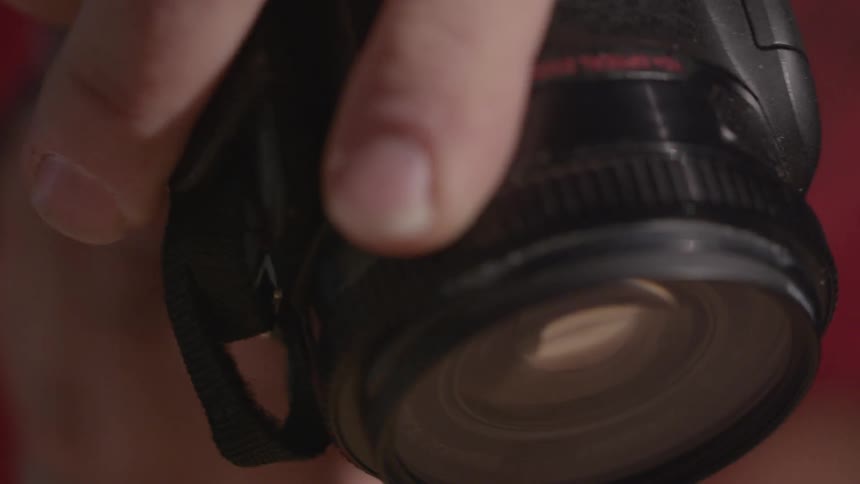 A close up of a photographer and their camera snapping photos with an ultra wide lense