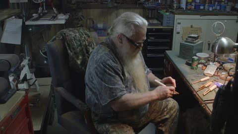 A man is fixing a watch