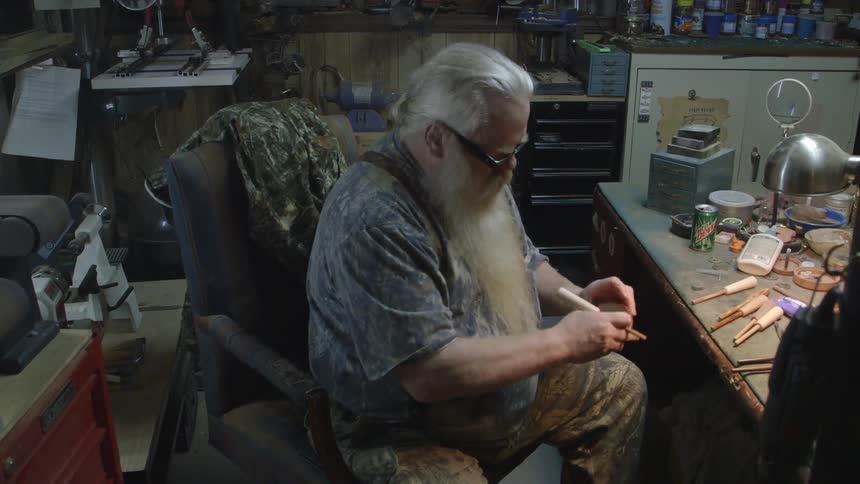 A man is fixing a watch