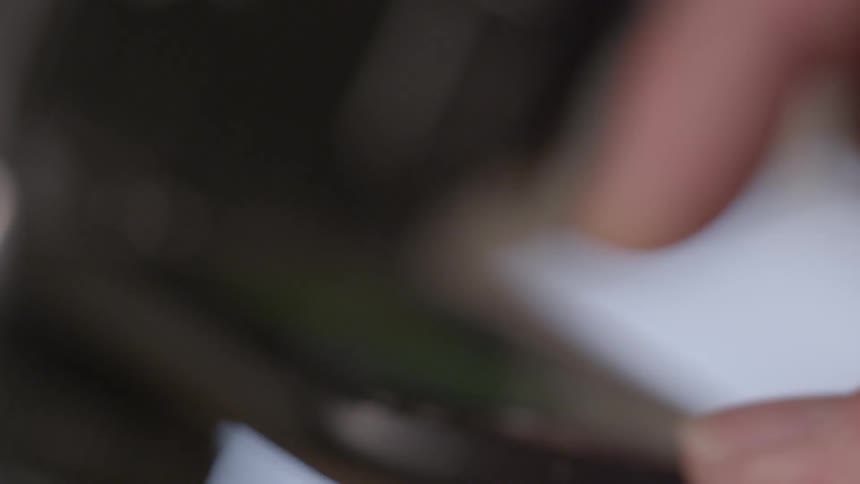 A person using a touch screen on a digital camera
