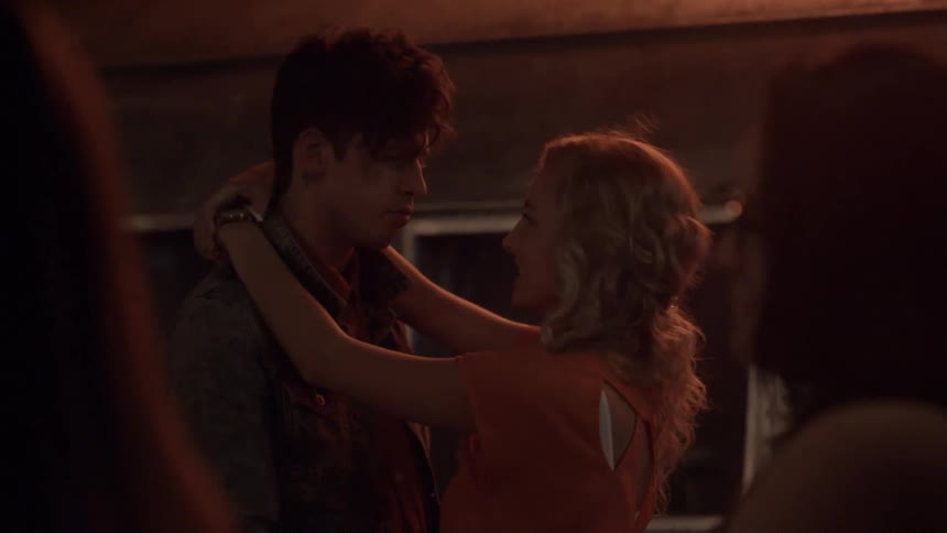 A man and a woman slow dance