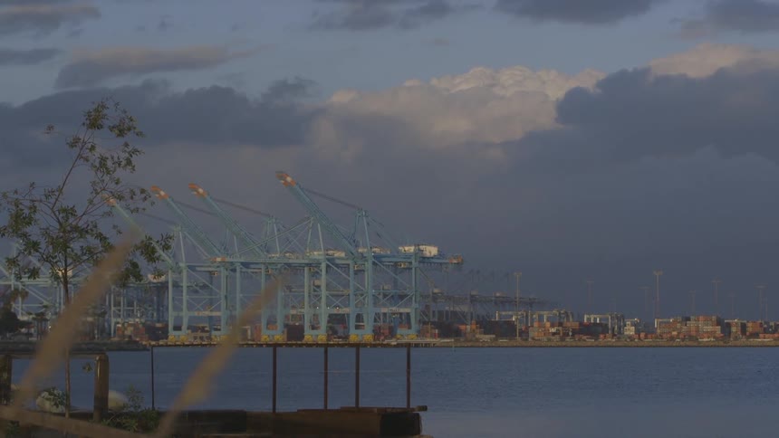 A loader for cruise lines sits in the distance
