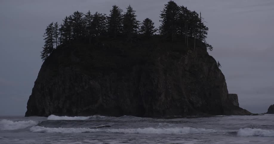 Waves flow around a protruding land formation in the ocean