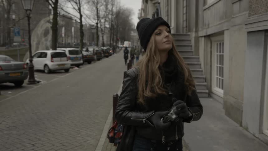 A woman is walking down the street