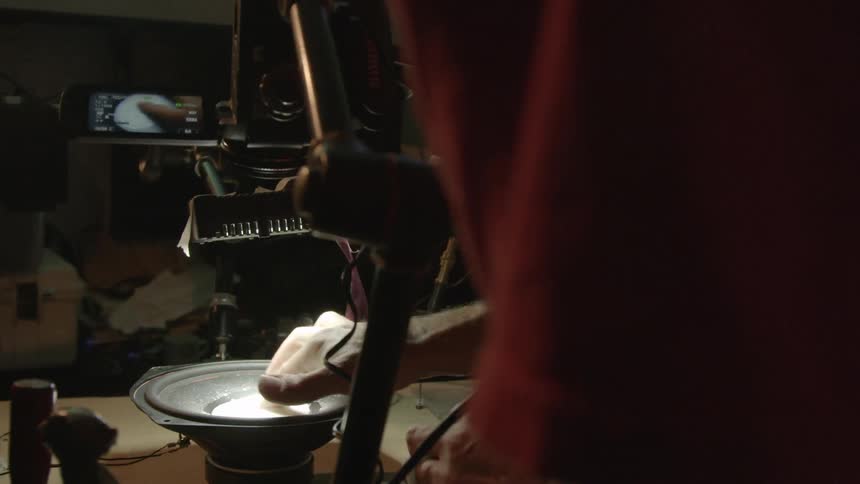 Man pouring powder into a bowl and mixing it