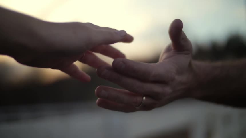 A couple of people holding hands