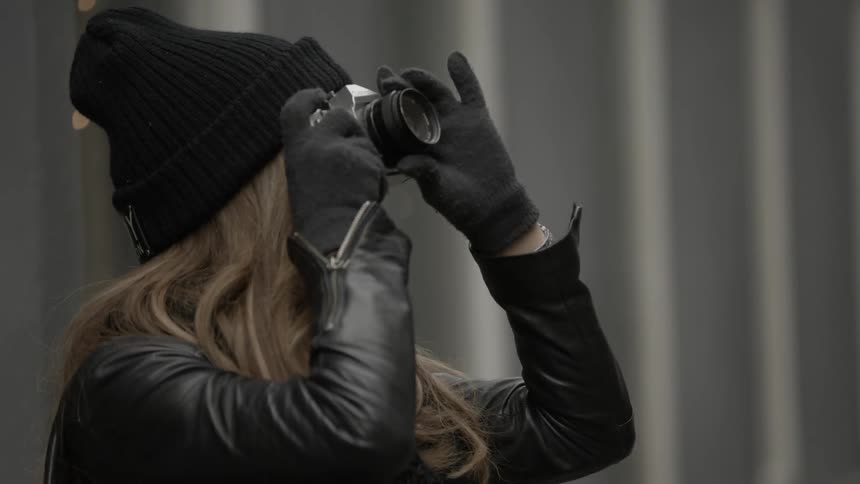 Woman taking pictures on a cold day