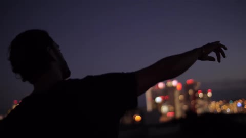 A person pointing off at the distance
