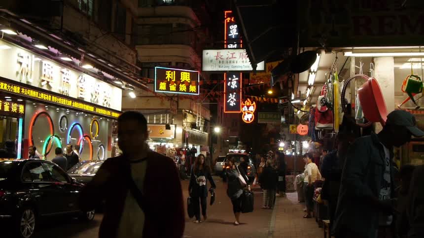 People walking down a busy city street