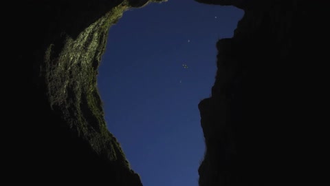 A shadowy cliff side