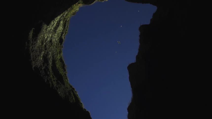 A shadowy cliff side