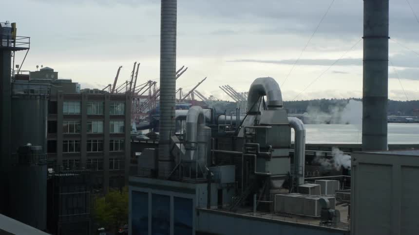 An industrial factory off of the freeway