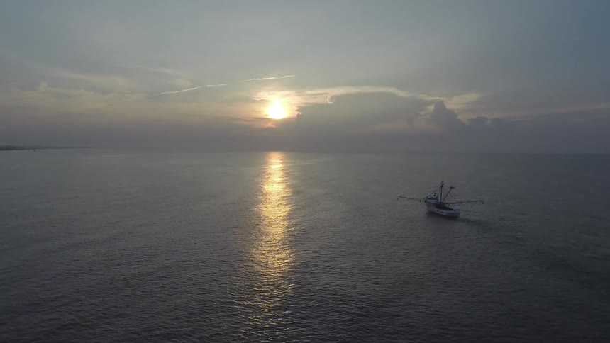 A fishing boat is moving forward