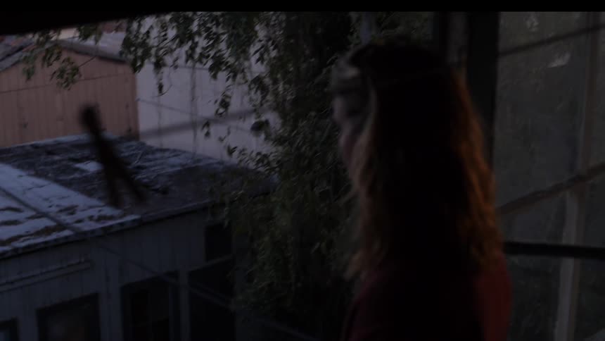A person staring out of a window