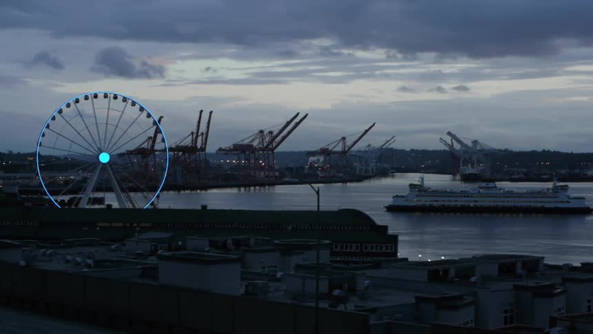 A ship enters a port while a ferris wheel rotates