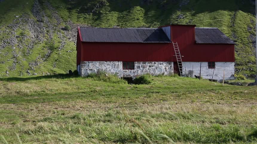 A red building out in the countryside