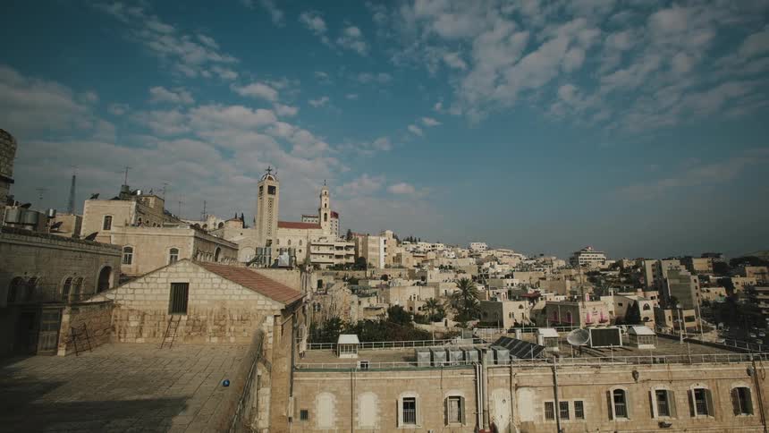 Time lapse of clouds passing over a small city