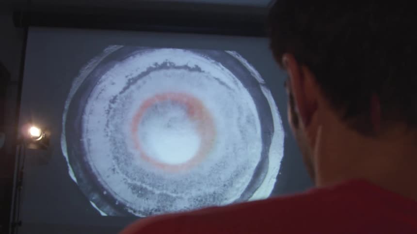 A person watching sound waves