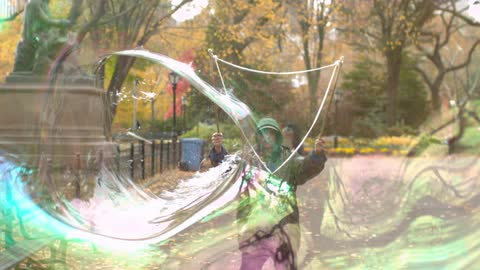 A person blowing bubbles