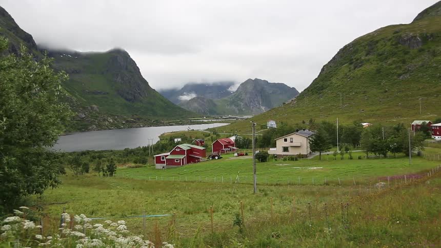 A farm near a lake in the countryside