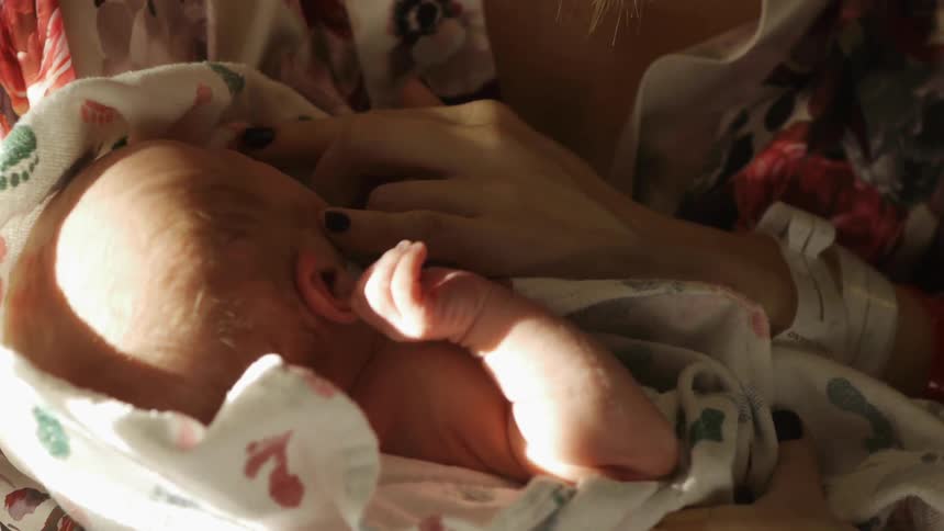 A person holding a baby