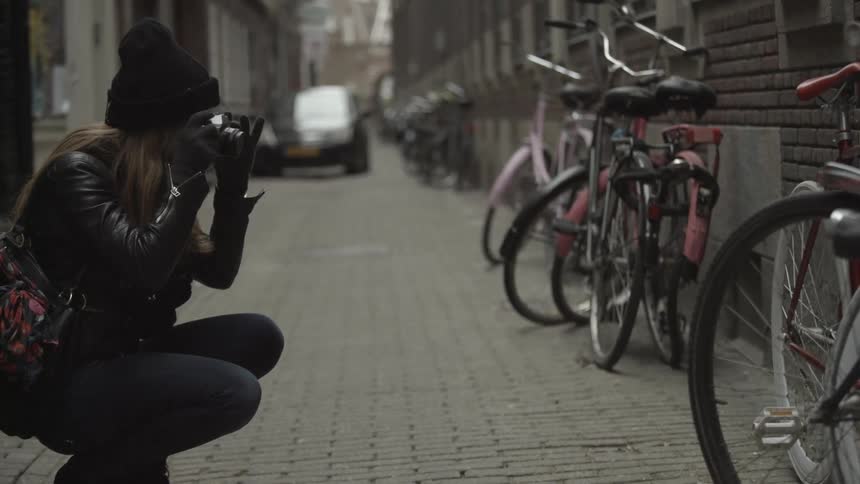 Woman taking a picture of a bike