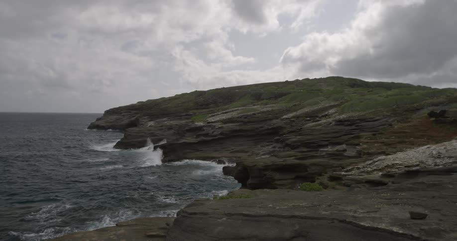 Slow motion of waves crashing on a rocky shore