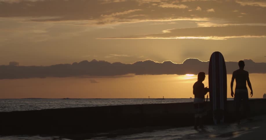 A group getting ready to surf at the beach
