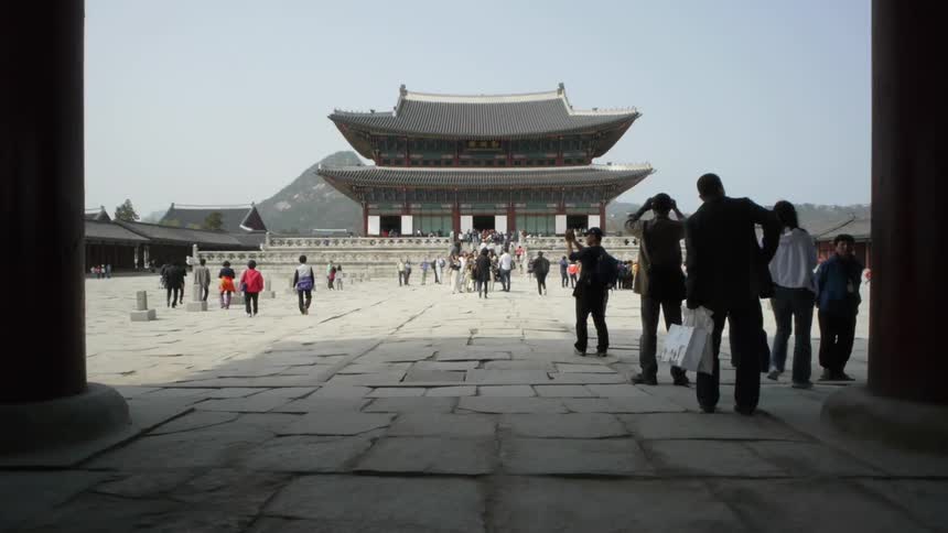 People are sightseeing near a building in china