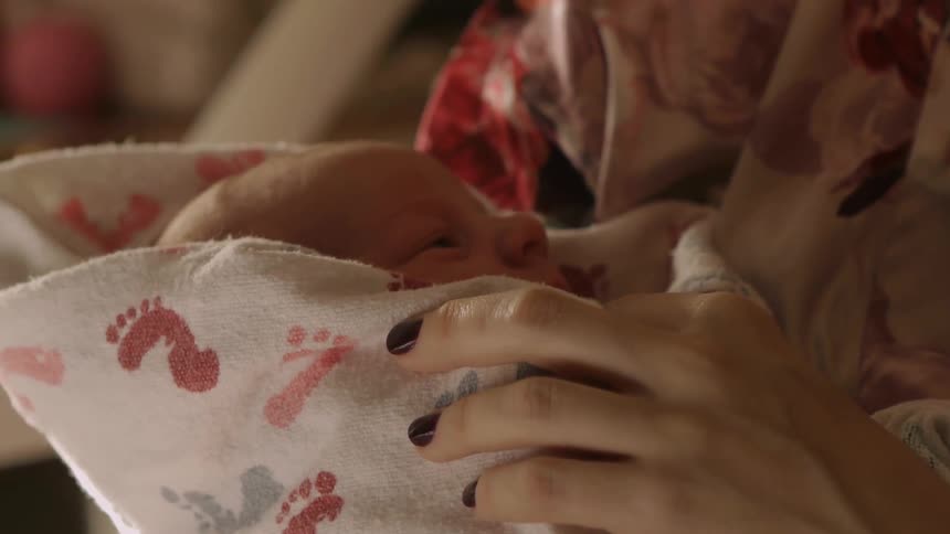 A person holding a baby