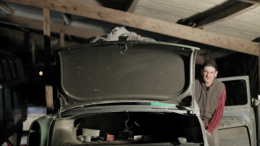 A person working on their car