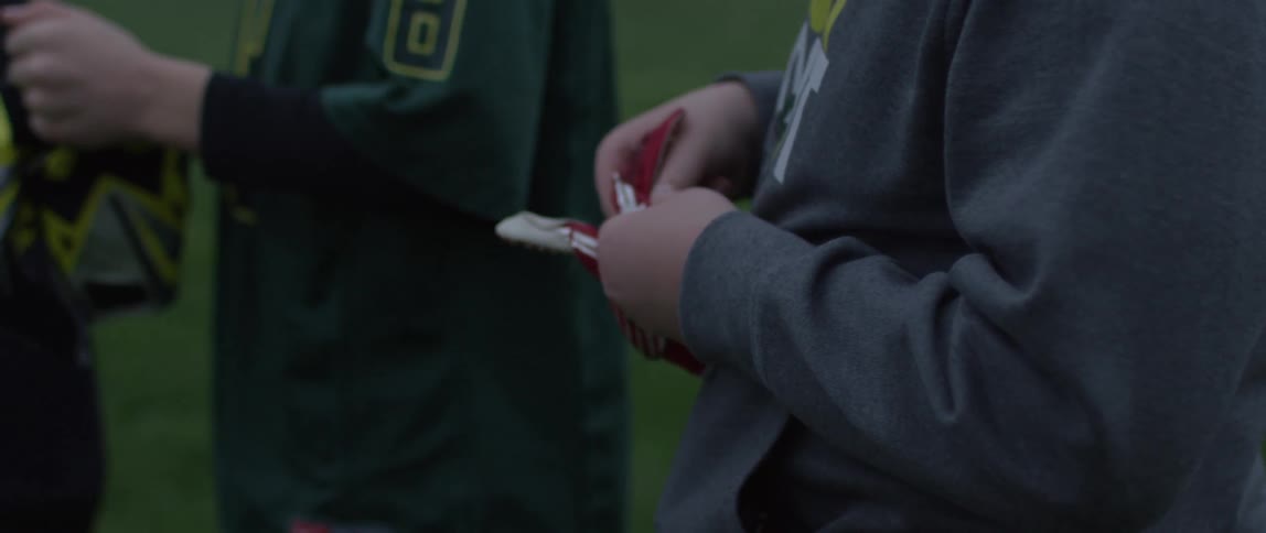 Boys are holding and adjusting gloves