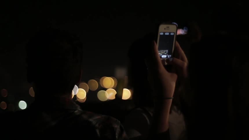 People filming fireworks show