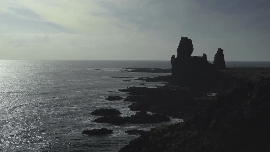 Ocean water crashing on a rocky shoreline